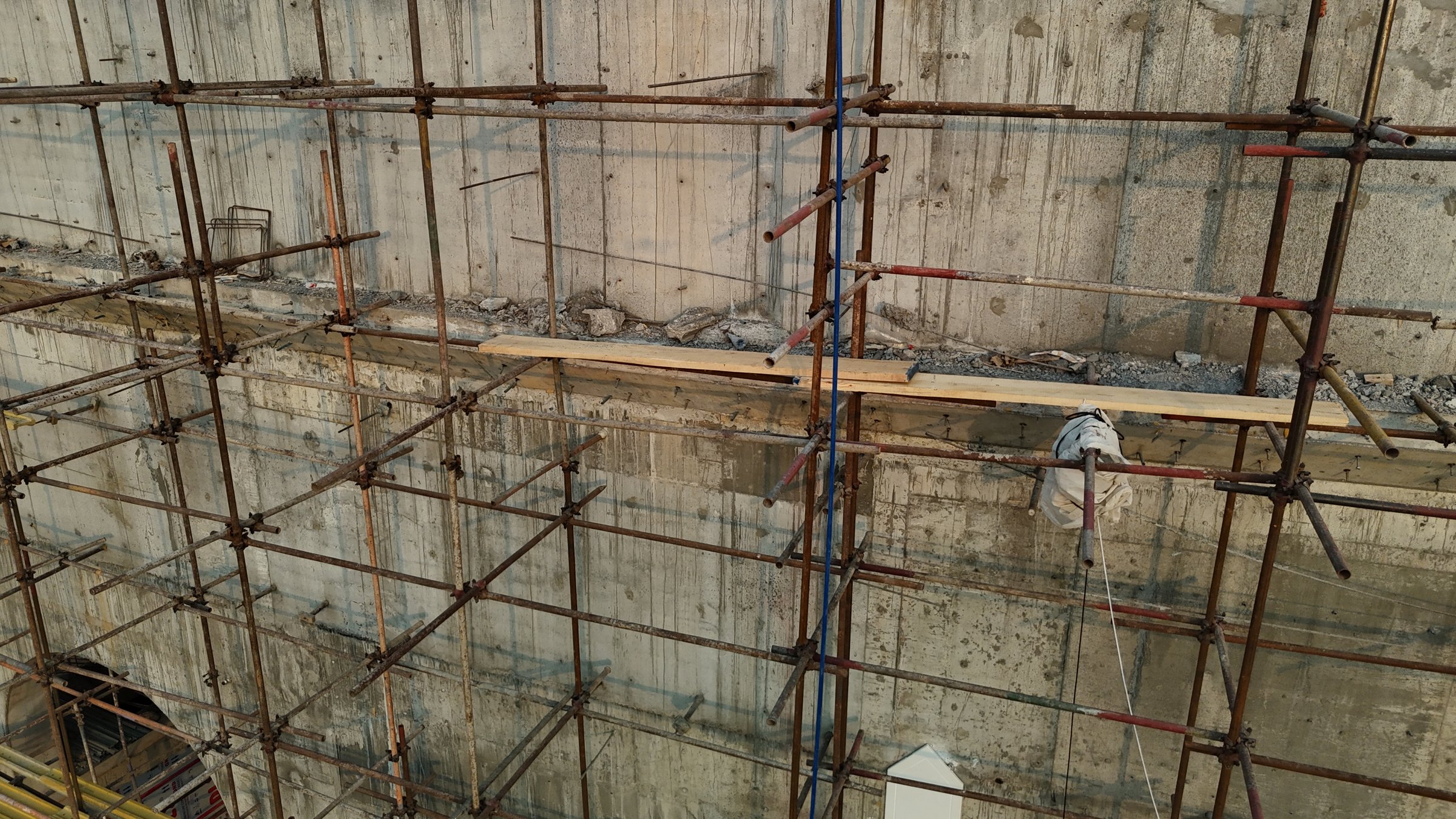 Scaffolding on a building site with clear access routes around the structure