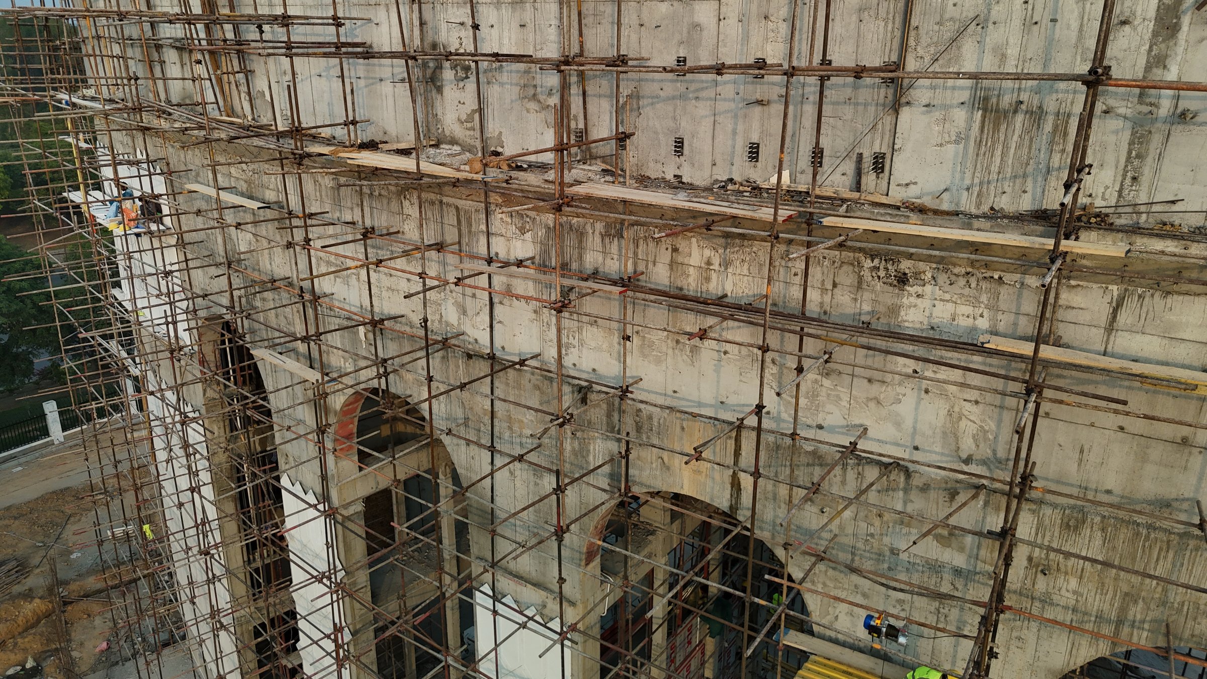 Scaffolded arches of the monument structure during marble installation