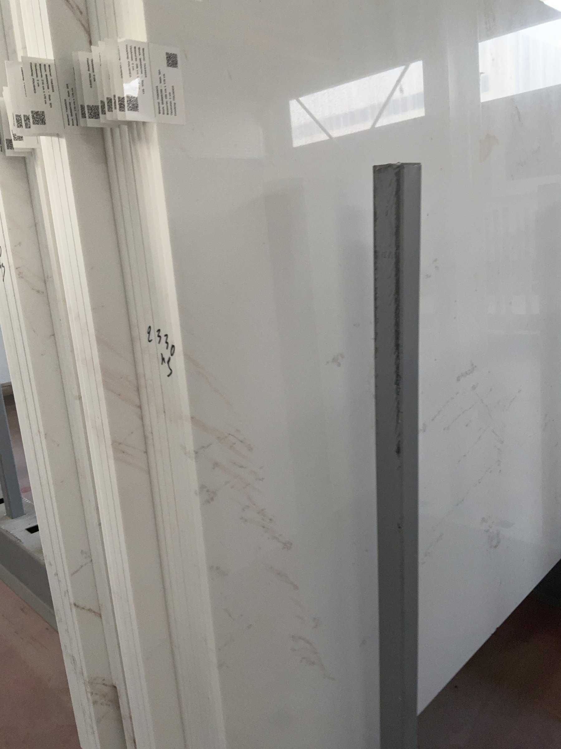 Natural veining on a polished white marble slab