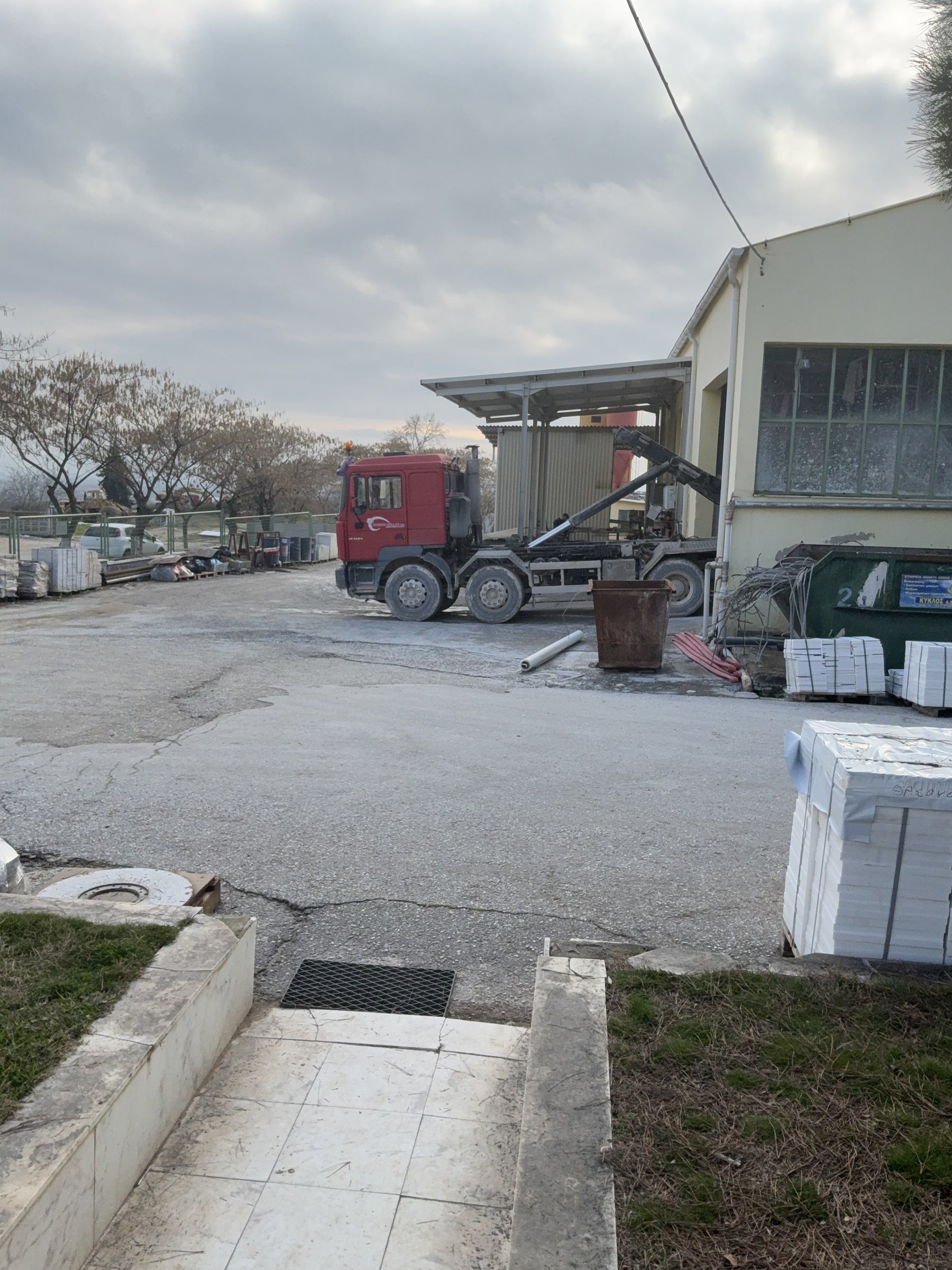 Truck and crated marble loads in the stone yard before shipping